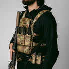 Side profile of a user wearing the Ferro Concepts Chesty Rig Mini V2 chest rig during firearms training, highlighting its low-profile fit and modular setup.