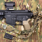 Ferro Concepts Slingster® Sling mounted on a rifle in MultiCam - combat-ready quick-adjust pull tab, one- or two-point setup, padded comfort and modular carry for shooters.