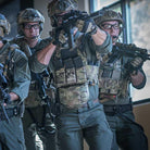 Military personnel wearing plate carriers equipped with Ferro Concepts The Dangler during tactical operations