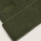 Close-up of eco-friendly waffle beanie in forest green with tonal Vans Flying V logo, ideal for winter range days, hikes, or everyday tactical fits.