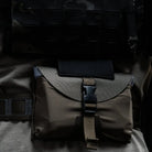 GBRS Group IFAS Individual First Aid System Pouch mounted on military plate carrier and law enforcement duty kit in field environment ready for rapid medical response