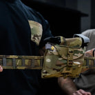 GBRS Group IFAS Individual First Aid System Pouch installed on kit during range training showing quick access emergency readiness