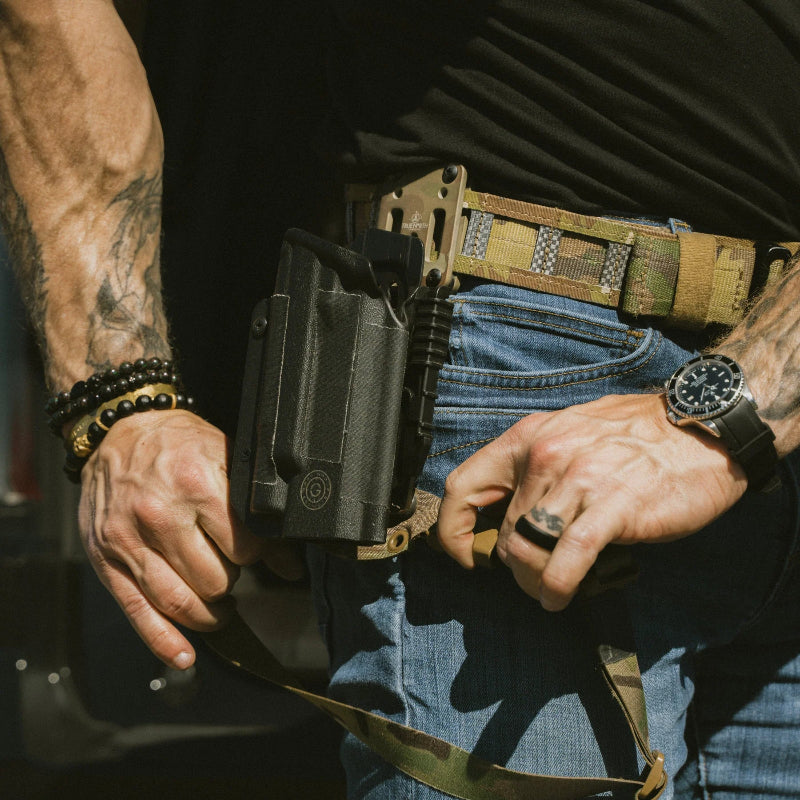 GBRS Group tactical leg strap being removed while worn, showing quick release adjustment and flexible thigh strap design, Tegris reinforced drop holster stabilizer compatible with True North Concepts MHA for duty belt and tactical range setups made in the USA