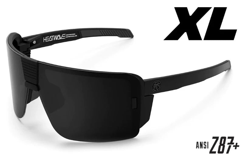 Side view of Heat Wave XL Vector Z87+ sunglasses showing forward-tilted matte black frame and dual-injected Hytrel® arms. XL fit design works with helmets and ear-pro while delivering Z87+ impact-rated protection.