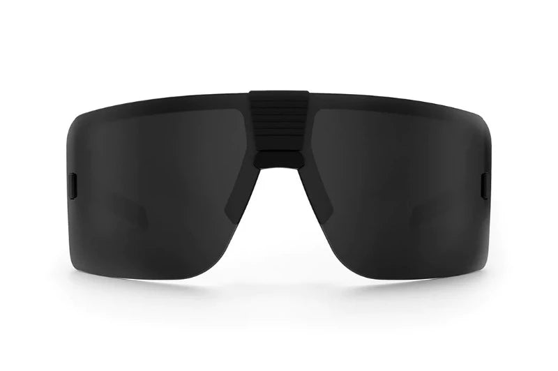 Front view of Heat Wave XL Vector Z87+ sunglasses in matte black with Polar Black lens. XL fit frame is 10mm wider and 4mm taller, ANSI Z87+ rated for impact protection, lightweight at 1.4 oz, and fully modular with replaceable shield lens.