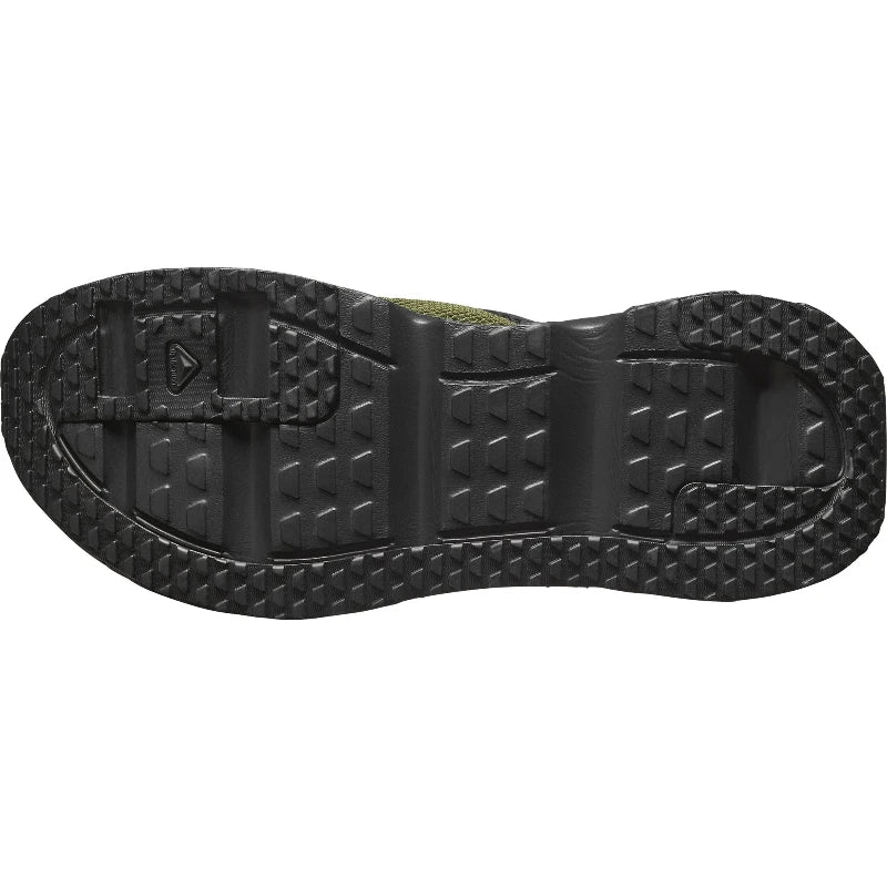 Close-up of a black shoe sole with tread pattern on a white background