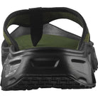 green sandal with black sole on a white background