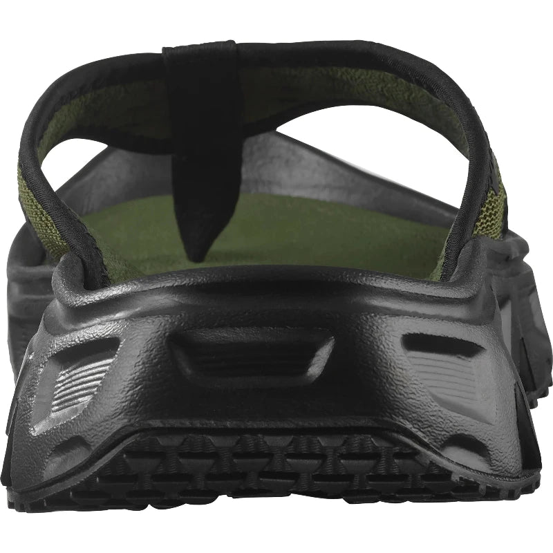 green sandal with black sole on a white background