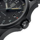 Close-up detail of the Luminox Atacama Field 1961 blackout watch showing the fixed CARBONOX bezel, protected IP-black crown, and case profile, emphasizing its rugged field construction, stealth tactical design, and durable Swiss-made build.