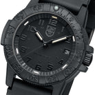 Close-up view of the Luminox Leatherback Sea Turtle 39mm watch face, showing the blacked-out dial, high-visibility markers, unidirectional bezel, and constant-glow illumination tubes engineered for tactical readability and outdoor durability.