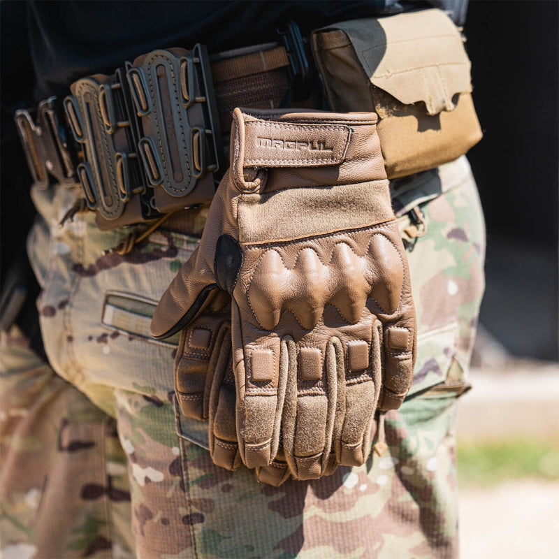 Magpul Breach Glove 2.0 Coyote flame resistant tactical gloves hanging from duty belt as part of a modular tactical kit setup