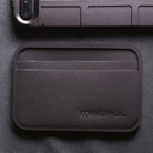 Magpul DAKA Everyday Wallet being used for travel and work showing rear clear ID window and organized card slots for quick identification access