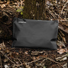 Magpul DAKA Lite Pouch Large Black holding electronics tools and clothing layers demonstrating lightweight packable storage