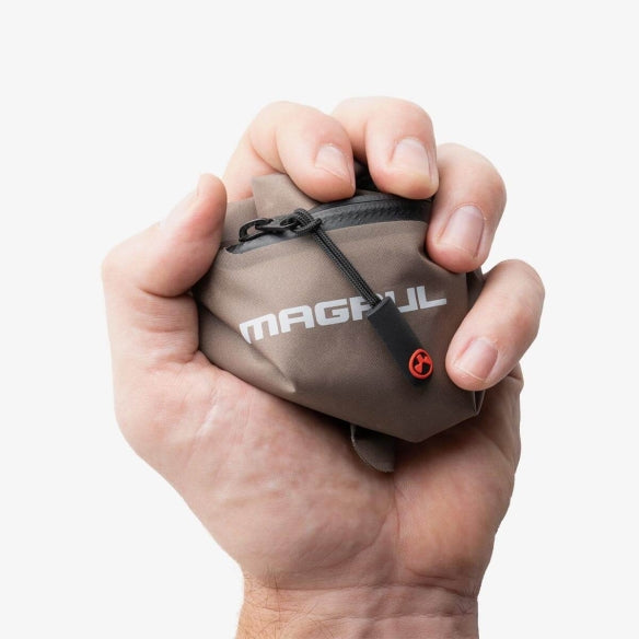 Magpul DAKA Lite Pouch Large Flat Dark Earth compressed in hand demonstrating lightweight collapsible nylon build
