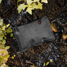 Magpul DAKA Lite Pouch Small Black holding cables batteries and small essentials inside backpack for lightweight organization
