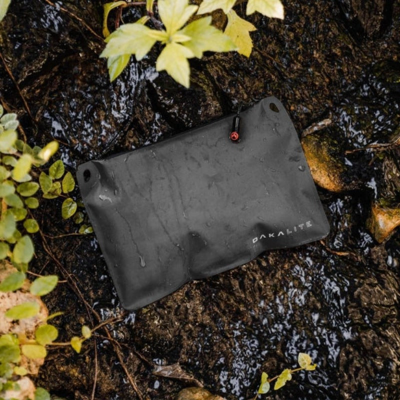 Magpul DAKA Lite Pouch Small Black holding cables batteries and small essentials inside backpack for lightweight organization