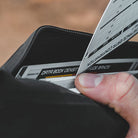 Magpul DAKA Pouch Medium open and packed with gear showing waterproof RF welded construction organizing range day essentials travel accessories tools boat gear and everyday carry items
