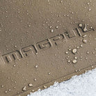 Magpul DAKA Pouch Medium showing gritty anti slip polymer texture with water droplets and snow demonstrating RF welded waterproof construction and all weather gear protection