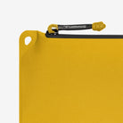 Magpul DAKA Pouch Medium Yellow featuring YKK AquaGuard water resistant zipper and 550 paracord pull for quick access in emergency or field environments