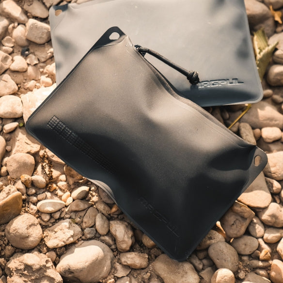 Magpul DAKA Pouch Small Black being used inside range bag organizing tools batteries and EDC gear showing compact waterproof construction in real world use