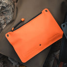 Magpul DAKA Pouch Small Orange compact waterproof organizer used in vehicle or overland setup holding cables tools and EDC accessories