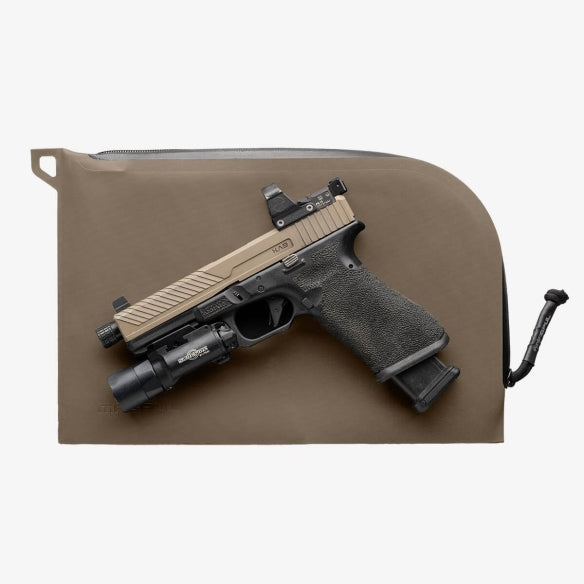 Magpul DAKA Single Pistol Case Flat Dark Earth displayed with handgun placed on top to demonstrate dimensions and fit for compact and full size pistols