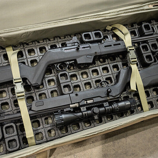 Magpul DAKA Universal GRID Organizer Rifle Kit installed in hard rifle case during range day transport securing rifle optic magazines and accessories with modular compression grid system