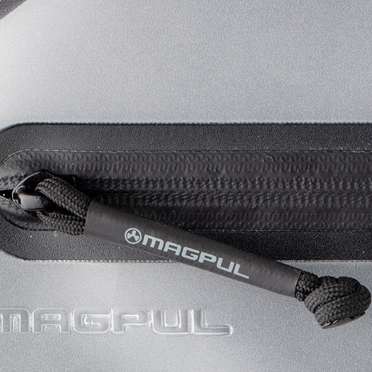 Magpul DAKA Volume Pouch close up of 550 paracord zipper pull with heat shrink tubing for glove friendly access