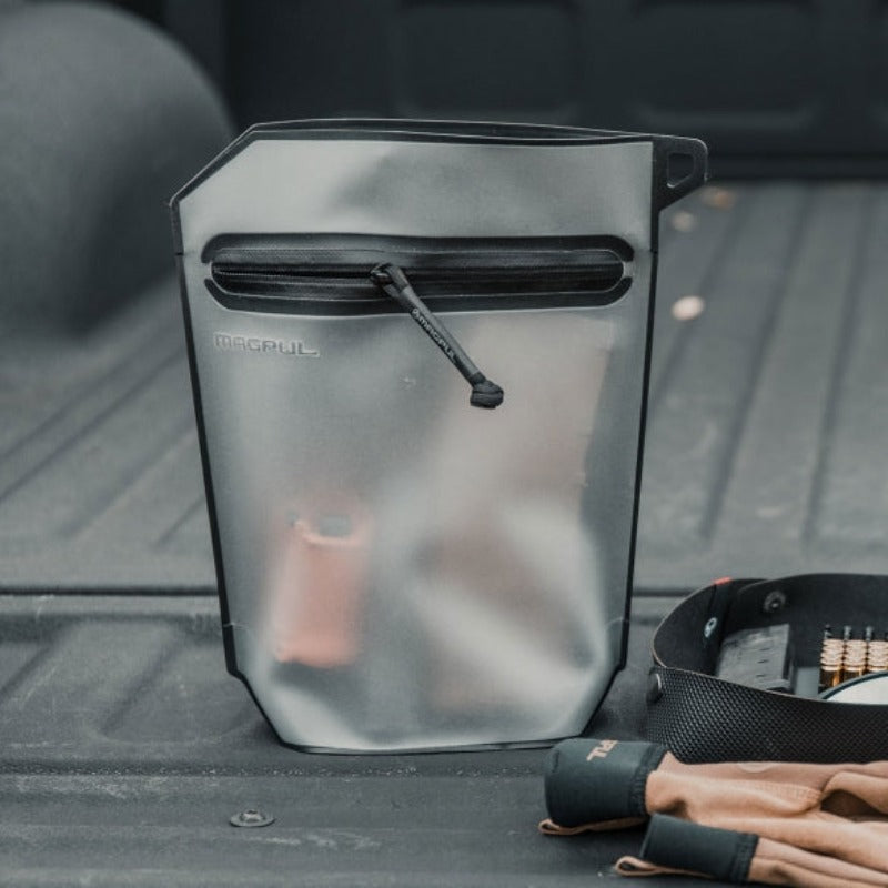 Magpul DAKA Volume Pouch Black expanded and filled with tools electronics and range gear demonstrating 3 liter capacity