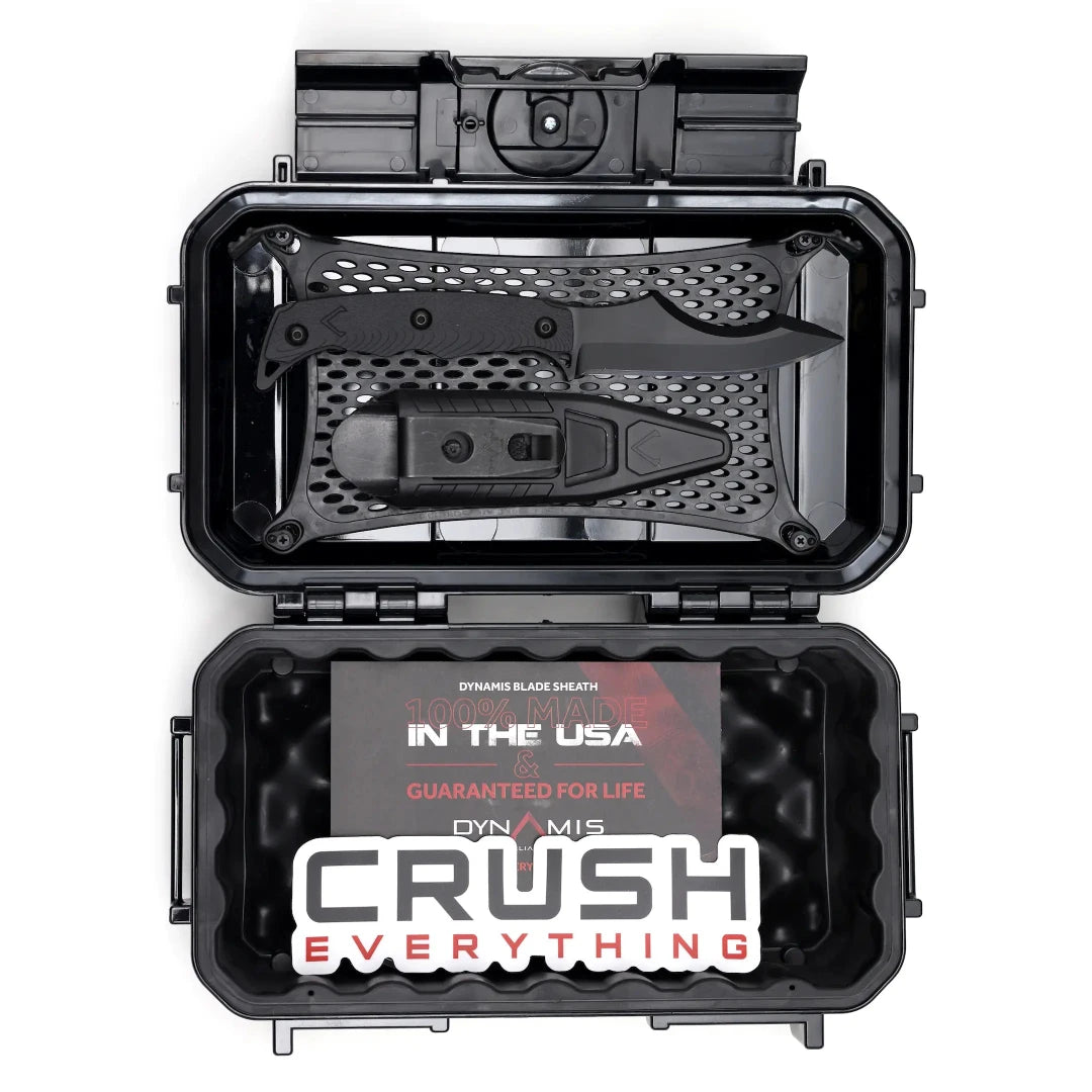 Black open case with a blade and sheath inside, featuring 'Dynamis' branding and text.