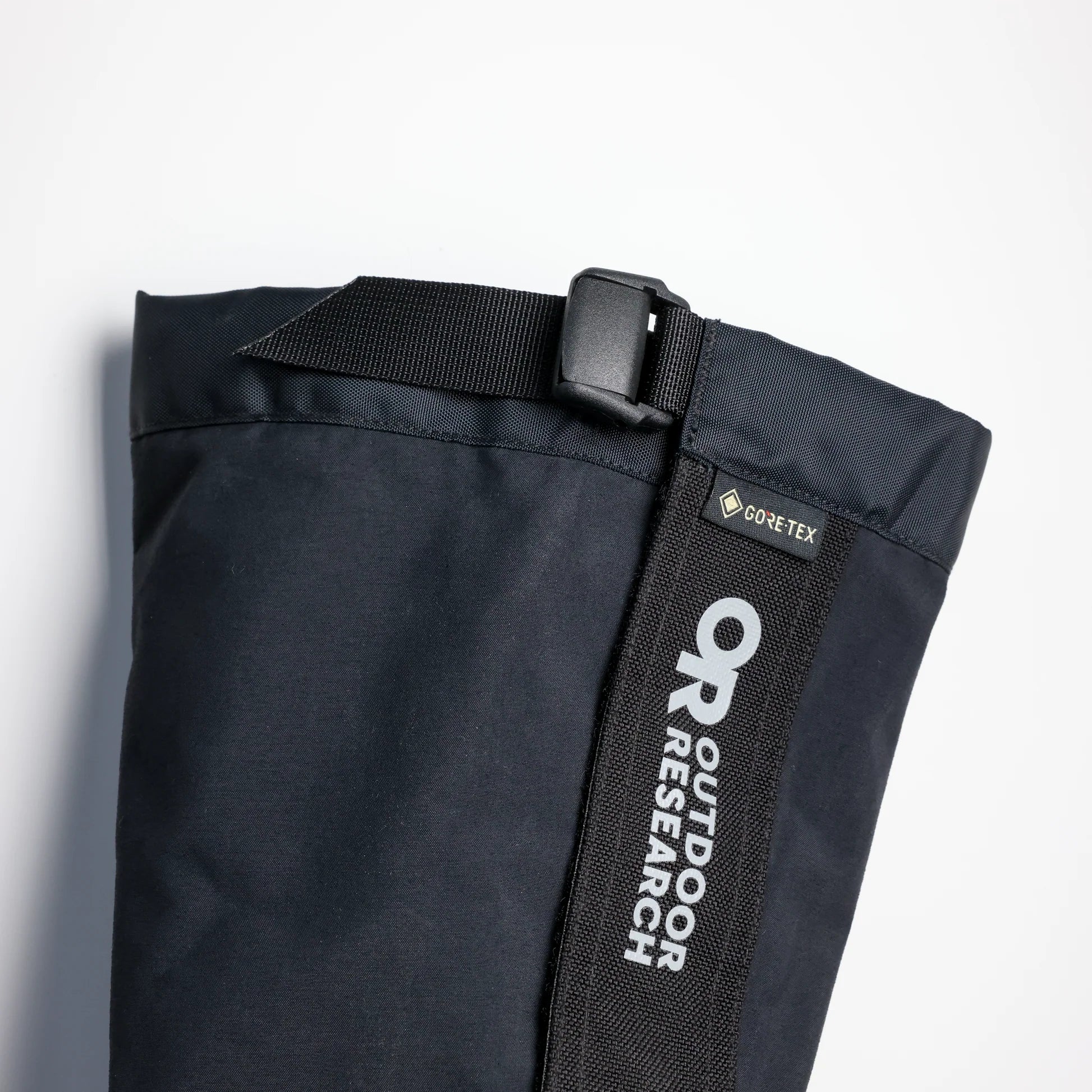 Close-up of Outdoor Research Crocodile Gaiters showcasing abrasion-resistant construction and adjustable camlock system.