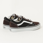 Angled view of Vans Old Skool brown and black suede canvas skate shoe highlighting vulcanized construction and padded collar