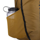 Detail view of the Outdoor Research Adrenaline Day Pack 30L in coyote, showing side mesh water bottle pocket designed for quick-access hydration during alpine, hiking, or tactical missions.
