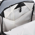 Interior view of the Outdoor Research Adrenaline Day Pack 30L in titanium, showing multiple storage pockets, hydration sleeve, and secure compartments for organized alpine gear carry.