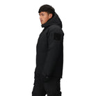 Three-quarter side view of the Outdoor Research Allies Colossus II Parka in black, showing zippered chest pocket, shoulder patch panel, and weatherproof shell for operational advantage.