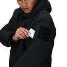 Close-up of the Outdoor Research Allies Colossus II Parka showing the zippered sleeve pocket, designed for quick-access storage of small essentials during Arctic expeditions, tactical missions, and extreme cold weather survival.