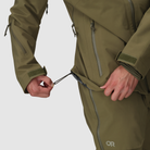 Close up detail of the Outdoor Research Allies Mountain II Jacket in Ranger Green showing the adjustable waist cinch, reinforced Cordura ripstop construction, and weather tight AscentShell design built for military, law enforcement, and alpine professionals needing secure fit and rugged waterproof performance.