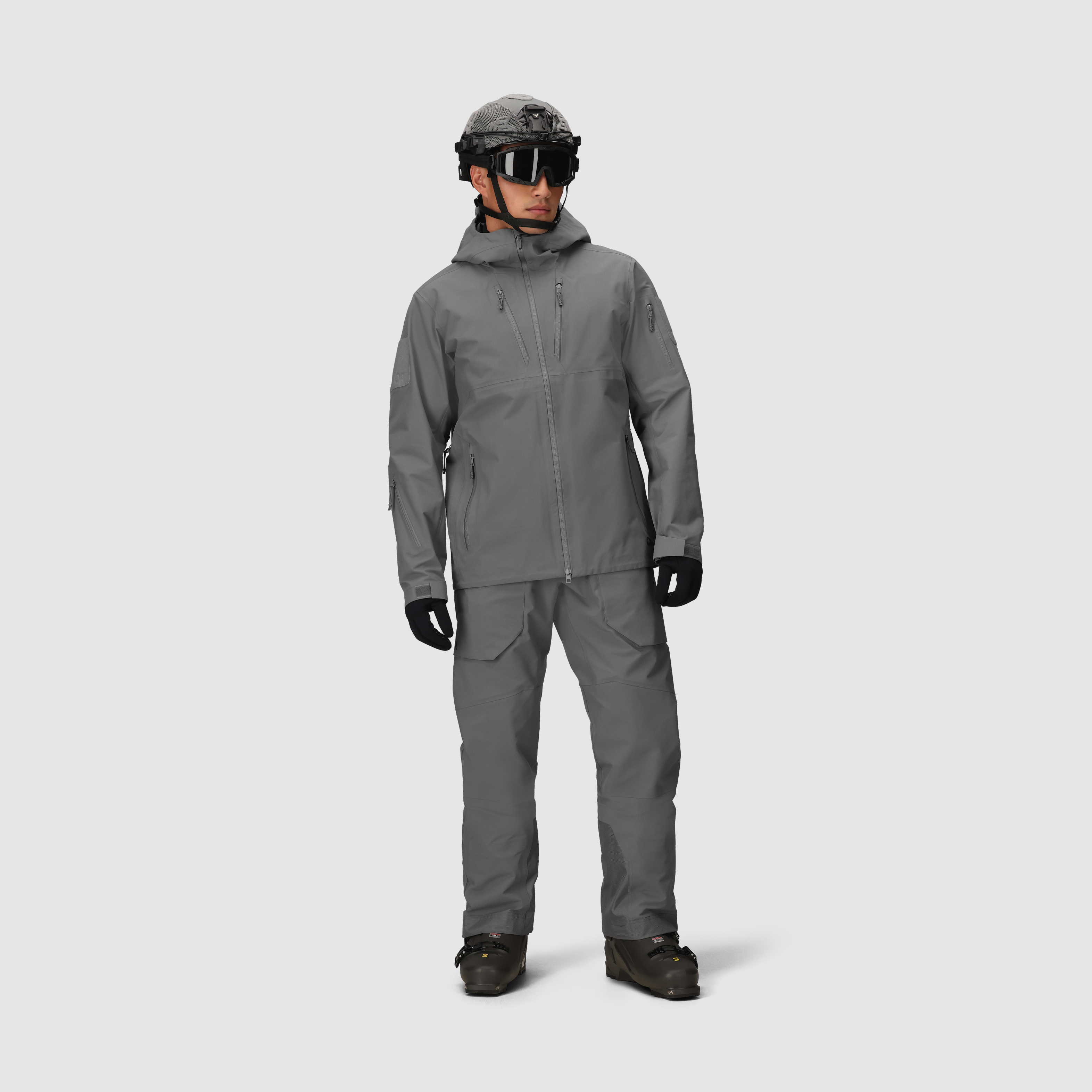 Full body view of the Outdoor Research Allies Mountain II Jacket in Wolf Grey showing the AscentShell waterproof construction, durable Cordura ripstop shell, helmet compatible hood, and articulated combat fit built for military, law enforcement, and alpine professionals operating in extreme weather and rugged terrain.