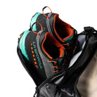 Outdoor Research CarryOut Duffel 40L in Black showing dedicated shoe compartment at the end of the bag | Rugged PU coated 420D ripstop nylon duffel with 40 liter capacity dirty clean gear divider external zip pocket and compression straps — best travel duffel with shoe compartment for tactical missions and outdoor gear