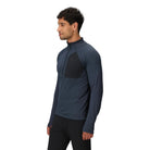 Three-quarter side view of the Outdoor Research Deviator Fleece Half Zip in Atlantic deep navy, showing insulated core, stretch sleeves, and breathable fleece fabric for active cold-weather layering.