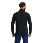 Back view of the Outdoor Research Deviator Fleece Half Zip in black, highlighting ergonomic fit, stretch panels, and streamlined design built for movement in cold-weather activities.