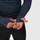 Close-up detail of the Outdoor Research Deviator Fleece Half Zip, highlighting stretch sleeve construction with integrated thumb holes for added warmth, coverage, and ergonomic fit during active cold-weather pursuits.