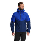 Outdoor Research Foray 3L Rain Jacket in Topaz Cenote navy and bright blue front view on model | Breathable waterproof 3 layer hiking shell with AscentShell Dry technology and TorsoFlo venting — best lightweight rain jacket for trekking climbing and outdoor use