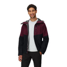 Outdoor Research Foray 3L Rain Jacket in Winterberry maroon and Black colorblock shown unzipped on model | Breathable 3 layer waterproof shell with AscentShell Dry technology TorsoFlo side venting and recycled nylon — best versatile maroon and black hiking rain jacket for outdoor performance and everyday wear