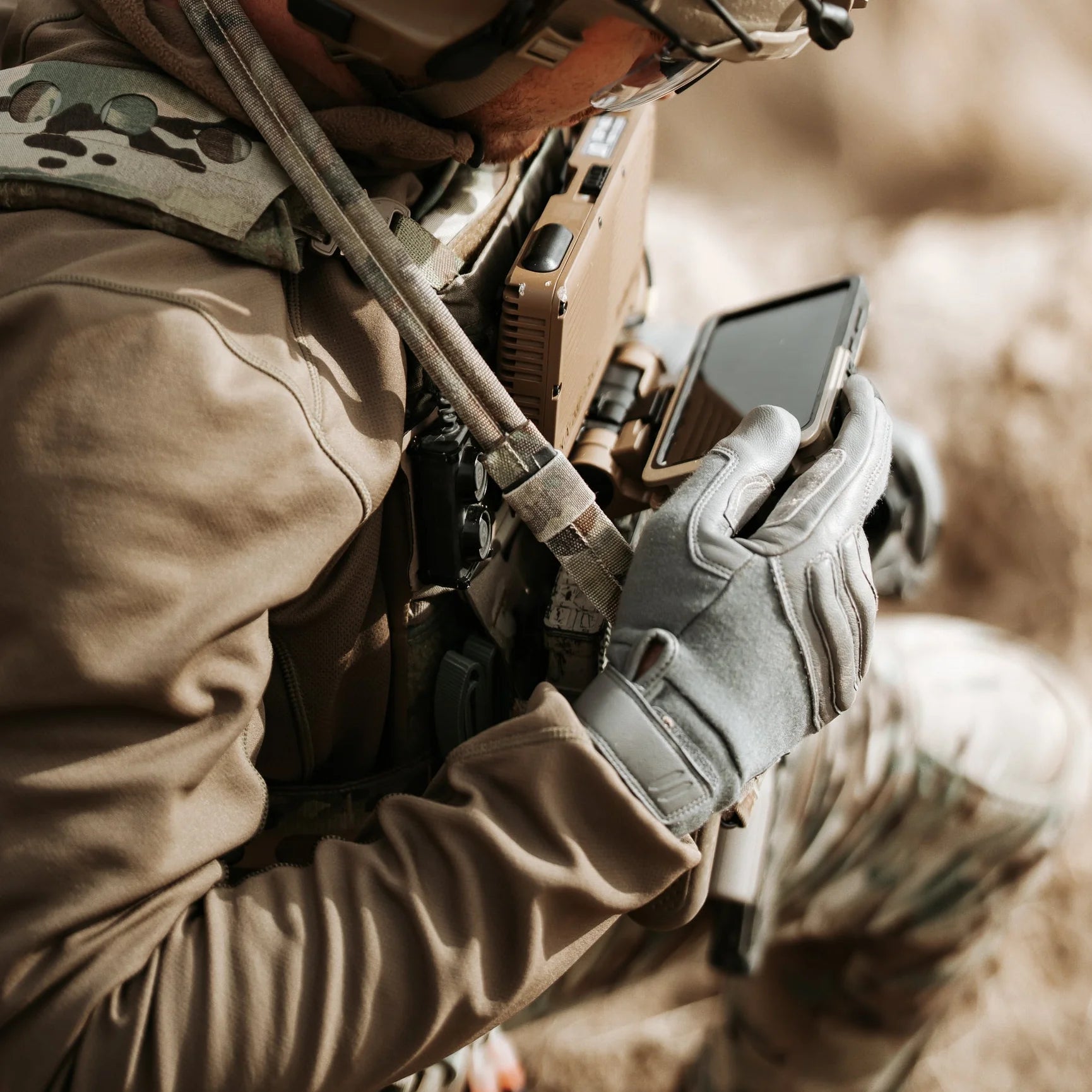 Operator wearing Outdoor Research Ironsight II FR Gloves in Wolf Grey during tactical training, flame resistant Nomex and Kevlar duty gloves integrated into full combat gear setup for military operations, range use, and law enforcement field applications
