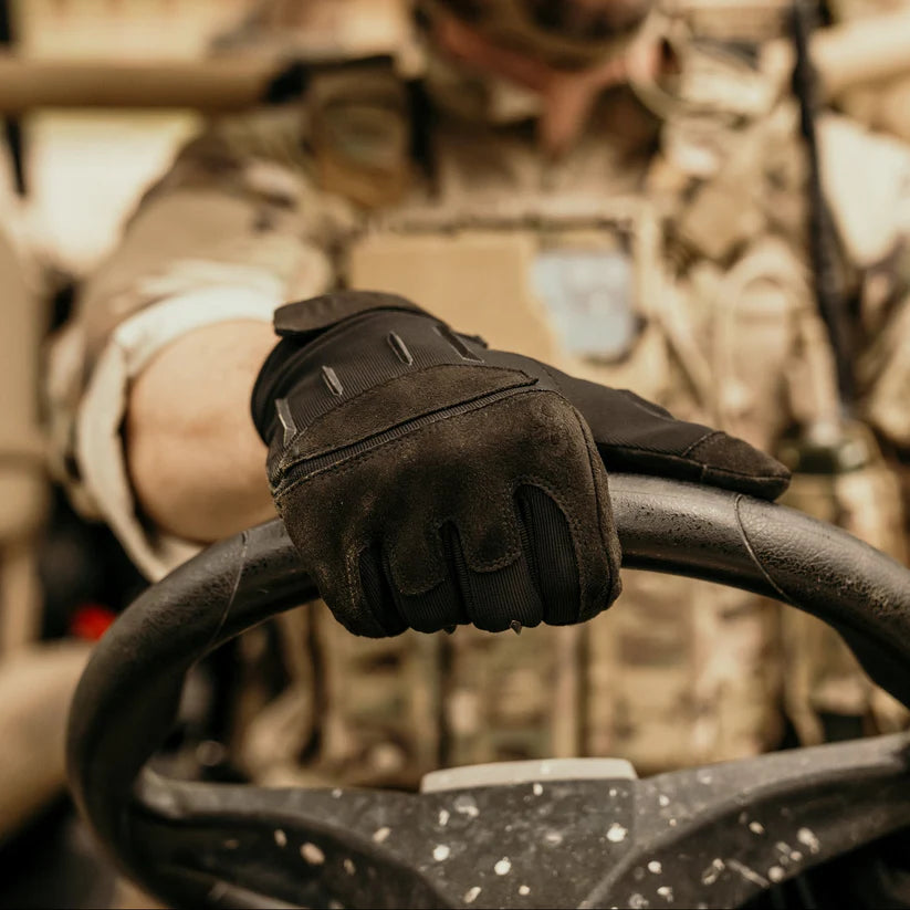 Black Outdoor Research Ironsight II Gloves shown in real field use, highlighting grip, dexterity, and durability during tactical movement. Demonstrates how the Ironsight II performs in active environments, ideal for searches related to tactical shooting gloves, EDC work gloves, and Outdoor Research field gear.