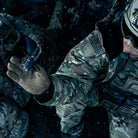 Coyote Outdoor Research Ironsight II Gloves shown worn in a cold tactical environment, highlighting insulation-friendly dexterity, secure grip, and dependable performance for military, law enforcement, and winter range operations. Optimized for searches on cold-weather tactical gloves and high-dexterity winter duty gloves.