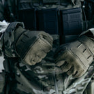 Ranger Green Outdoor Research Ironsight II Gloves worn with full duty uniform and kit, demonstrating secure grip, mobility, and professional-grade durability for law enforcement and military field operations. SEO optimized for tactical duty gloves, range gloves, and professional EDC glove searches.