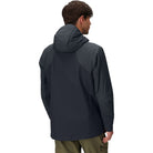 Back view of the Outdoor Research Shadow Hybrid Hoodie in black, highlighting breathable uninsulated panels, articulated athletic fit, and mobility-focused construction designed for alpine climbs, rucking, and military cold-weather missions.