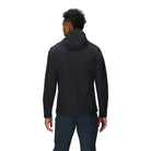 Back view of the Outdoor Research Ultima Soft Shell Hoodie in black, highlighting streamlined fit, articulated sleeves, and gusseted cuffs for unrestricted alpine mobility.